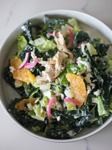 Souvla chicken ranch salad in a bowl on a white counter
